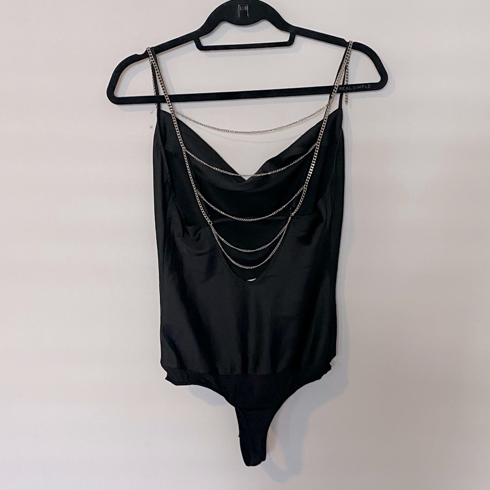 Bebe bodysuit w/ hanging silver chains on back